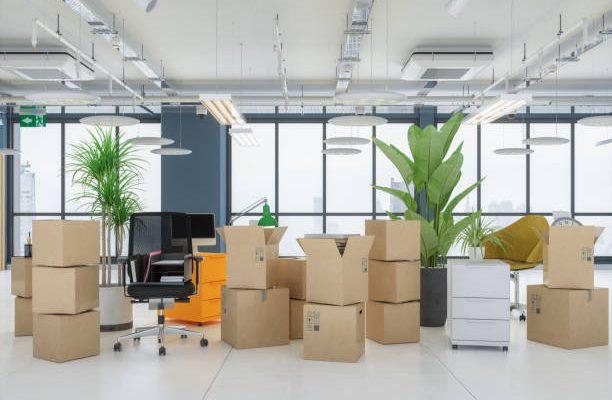 Carton boxes in empty office. moving office concepts.